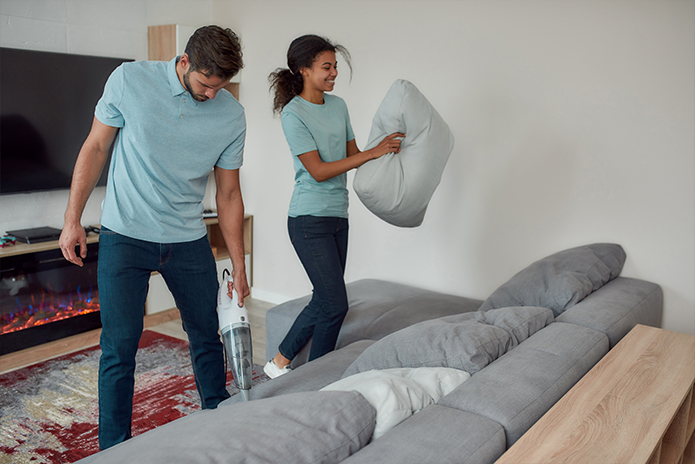 couple cleaning lounge